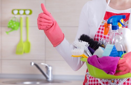 Cleaner wearing PPE while carrying out safe carpet cleaning in Wimbledon