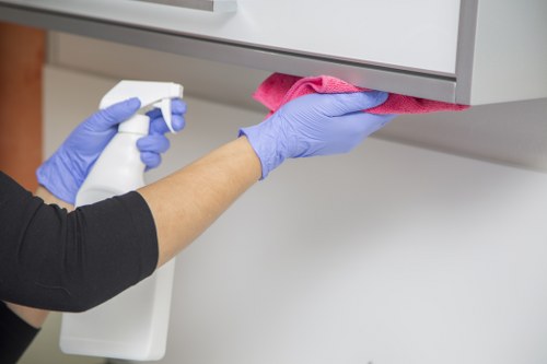 Specialist office cleaners in Wimbledon performing a deep clean in a business office